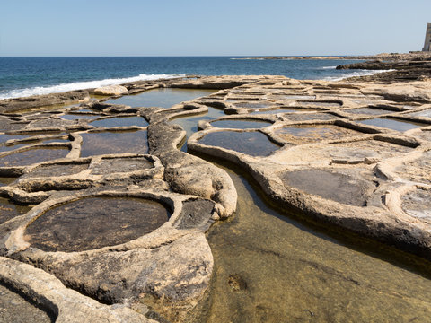 Historic salt pans filled with seawater, Marsaskala, Malta