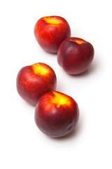 .Nectarines isolated on a white studio background.
