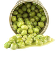 Green peas in a tin can over white background