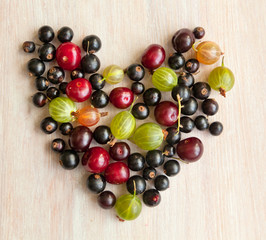 berries of black currant, cherry and gooseberry in the form of h