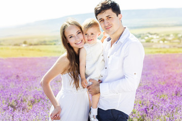 Happy family having fun in lavender field