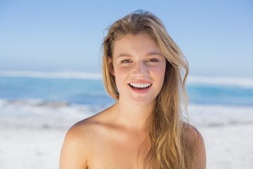 Fototapeta na wymiar Beautiful happy blonde on the beach