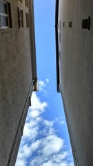 Blue sky between houses