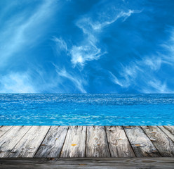 Naklejka na ściany i meble Tropical sea and wooden floor background