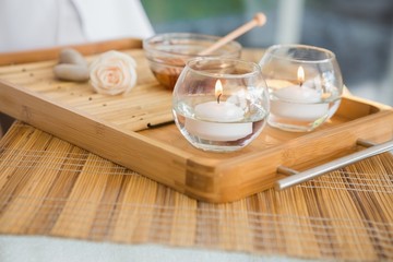 Candles and beauty treatment on tray