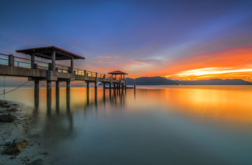 Fototapeta na wymiar A nice and beautiful sunset on an island jetty