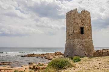 Fototapeta na wymiar Ancient tower on the beach