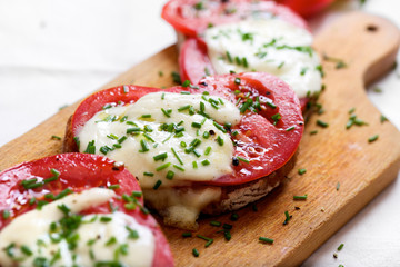 Bruschetta with fresh tomato, mozzarella cheese  and chive