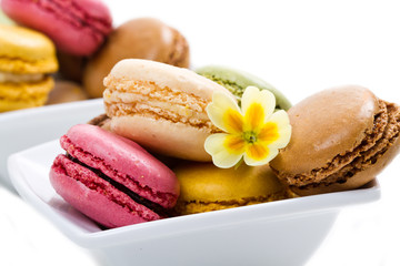 white bowl with colored macaroons