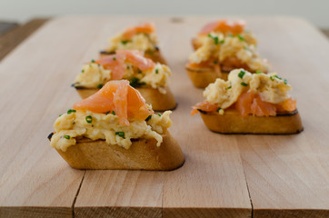 Toast with smoked salmon with scrambled eggs