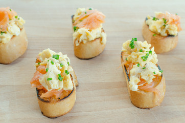 Toast with smoked salmon with scrambled eggs