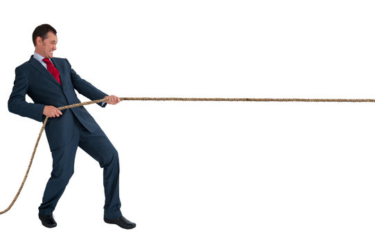 Businessman Pulling A Rope