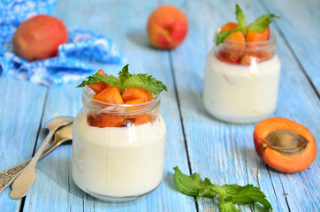 Greek yogurt with apricots in the jar.