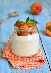 Greek yogurt with apricots in the jar.