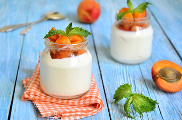 Greek yogurt with apricots in the jar.