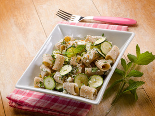 pasta with feta cheese zucchinis and mint leaf
