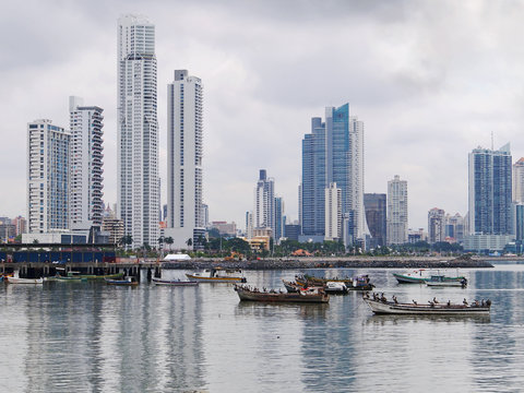 Fishing boats anchored with skyscrapers in Panama
