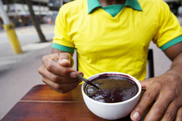 Brazilian Man Eating Bowl of Acai Açaí