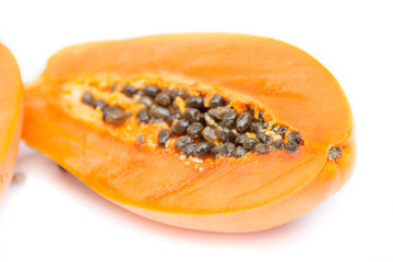 Half of papaya fruit isolated on white with clipping path