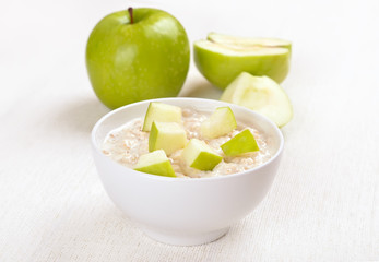 Oatmeal porridge with apple slices