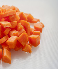 Cut carrot on white background close up