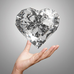 hand holding 3d diamond heart shape as concept