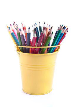 The set of varicoloured pencils in the pail