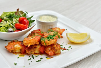 Brochettes with marinated and fried shrimps