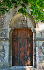 Door of church in Han-sur-Lesse, Belgium