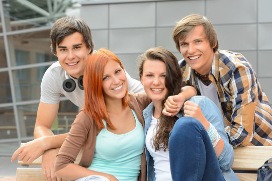Cheerful student friends together outside campus