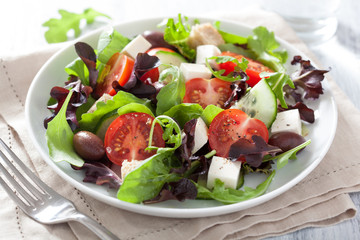 healthy salad with tomatoes olives and feta cheese