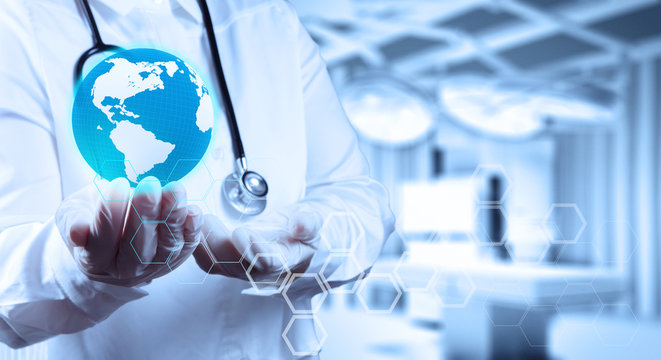 Medical Doctor holding a world globe in her hands as medical net