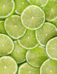 Green background with citrus-fruit of lime slices