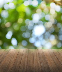 Wooden deck table over beautiful bokeh background 