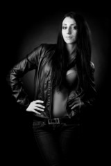 brunette in leather jacket. black and white photo