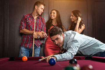 Fun with friends during playing billiard - 67239660