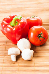 Tomatoes, red pepper, and white mushrooms.