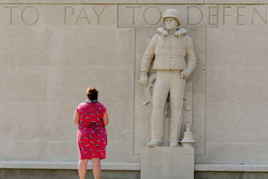 Lady paying respect at US World War Two Military cemetery