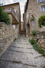 Narrow street in medieval town Gordes, southern France