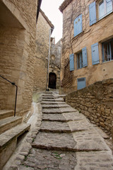Fototapeta na wymiar Narrow street in medieval town Gordes, southern France