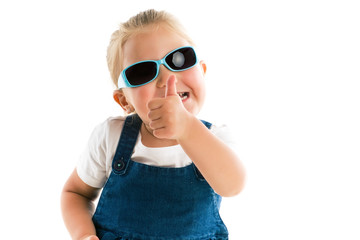 Fototapeta premium Little girl showing thumbs up