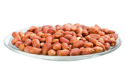 heap of roasted peanuts in a saucer