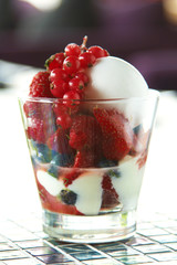 close up milk icecream and mixed berry in glass