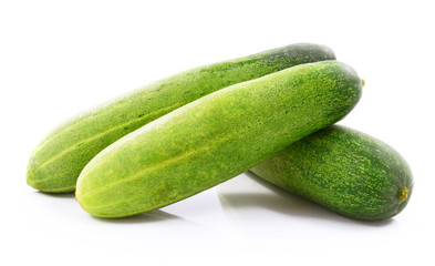 Healthy food. The green cucumbers isolated on white background
