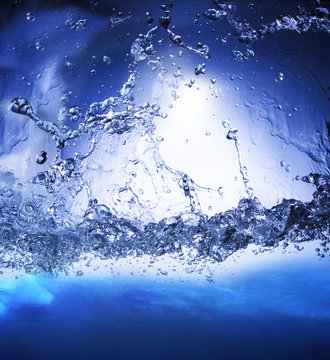 splashing blue water use as nature background ,backdrop and natu