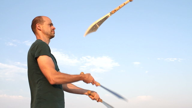 Man Juggling Knives