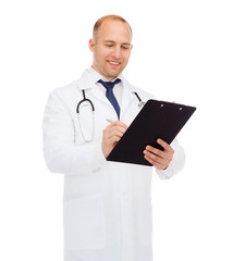 smiling male doctor with clipboard and stethoscope