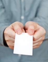 blank business card in female hands
