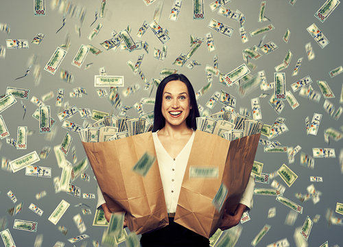 excited businesswoman with money