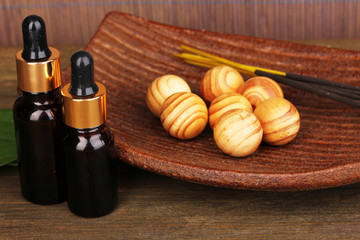 Obraz na płótnie Canvas aromatherapy setting on brown bamboo background .